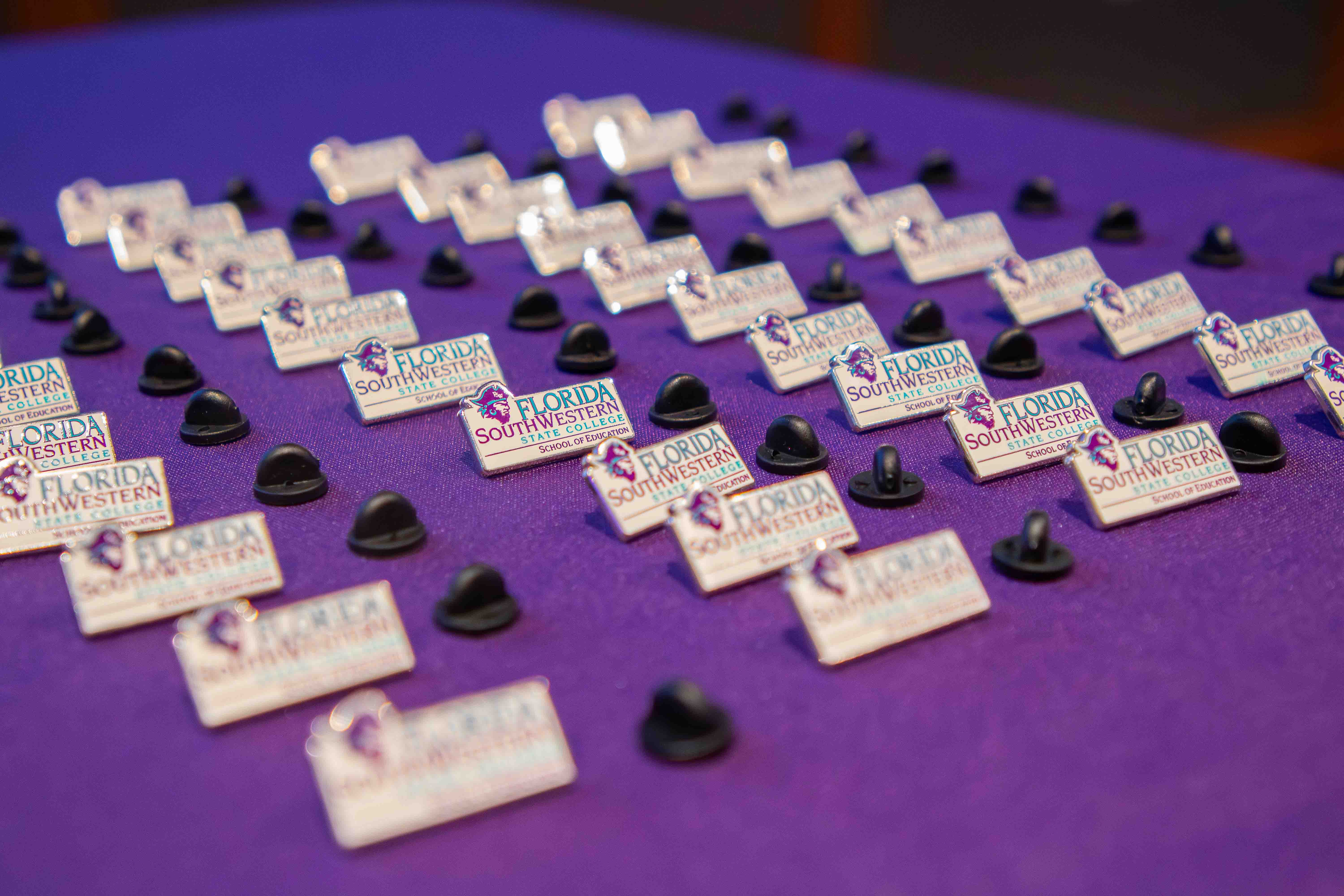 Education pins sit ready for the 42 graduates of FSW’s Elementary Education program.