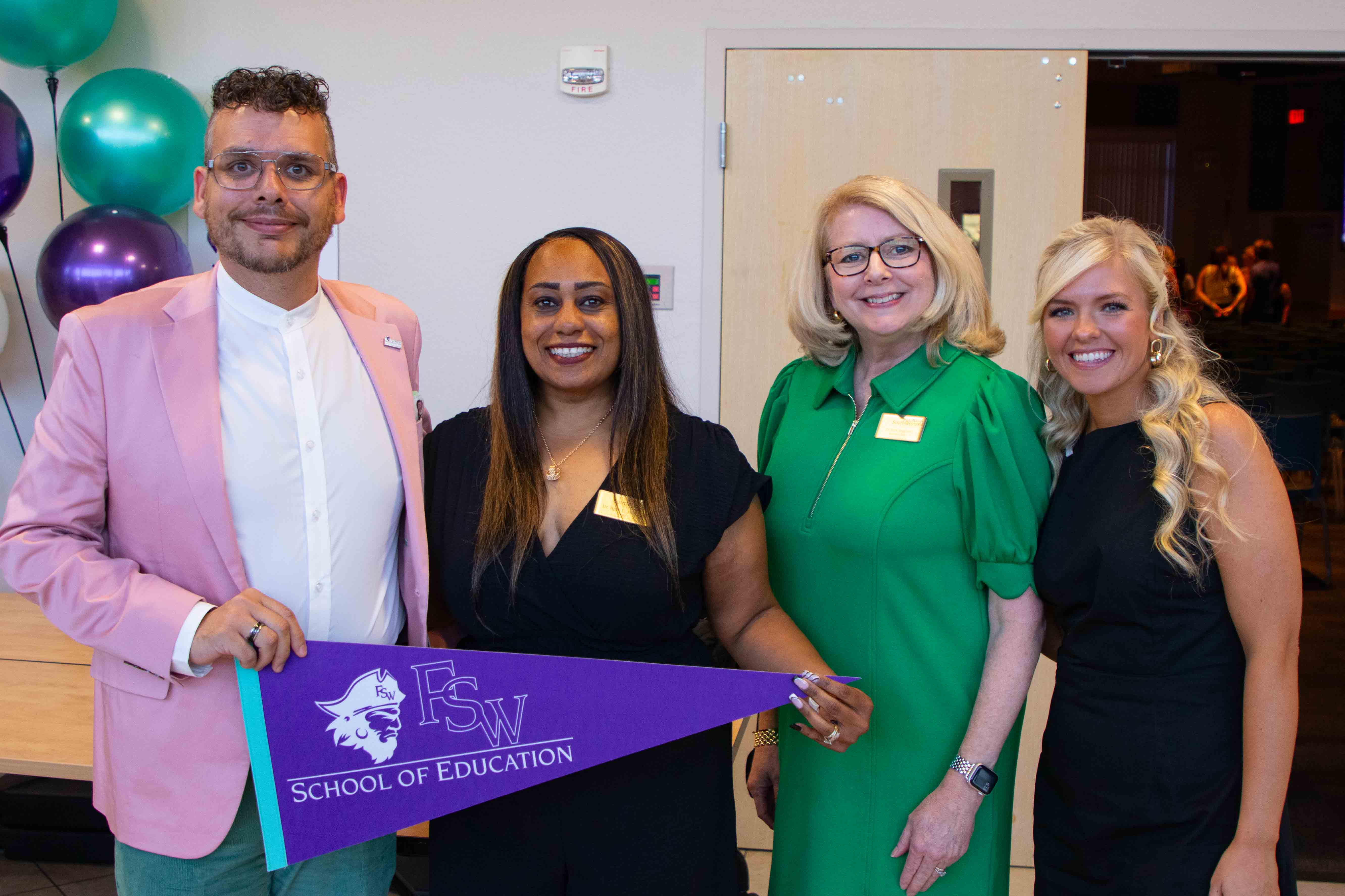 Pedro Bretones, Dr. April Fleming, Dr. Anne Angstrom, and Keely McKinney pictured at the conclusion of the FSW's School of Education Pinning Ceremony.
