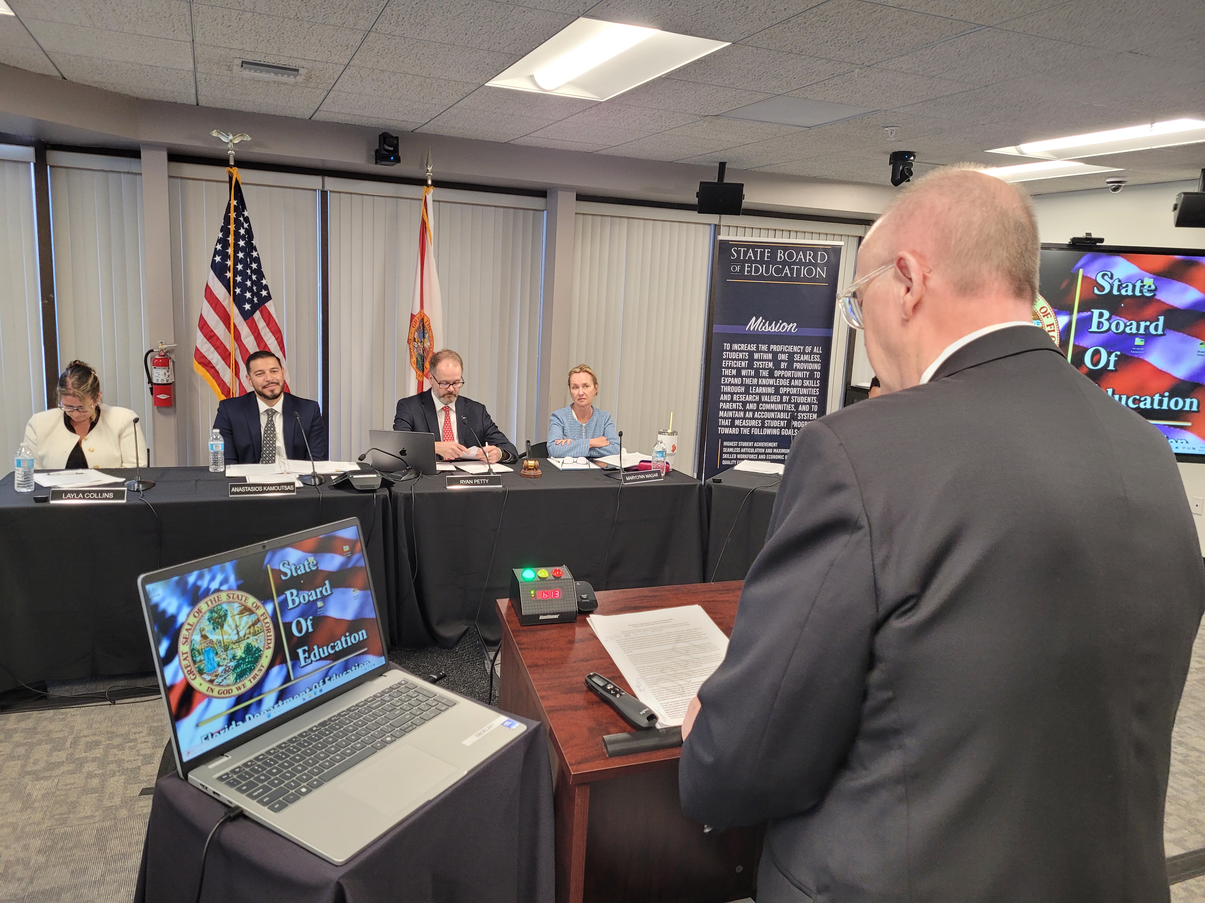 State Board of Education members listen as Dr. Jeffery Allbritten presents FSW updates and alumni achievements.