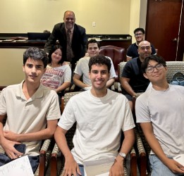 Professor Matthew Hoffman and Business Law students take in the Board of Trustees meeting.