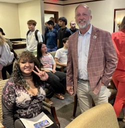 Trustee Danny Nix spends time with students observing the meeting.