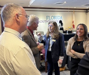 Provost Judy Bilsky speaks with Trustee Keith Arnold while Trustee Jullia du Plooy discusses the new semester with Dr. Martin McClinton, associate vice president of Academic Affairs.