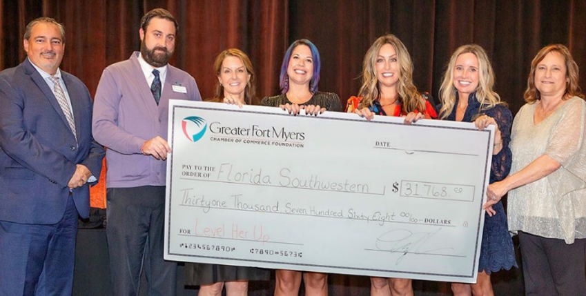 Representatives from FSW and the Greater Fort Myers Chamber of Commerce pose with a ceremonial $31,768 check supporting students pursuing health care careers.