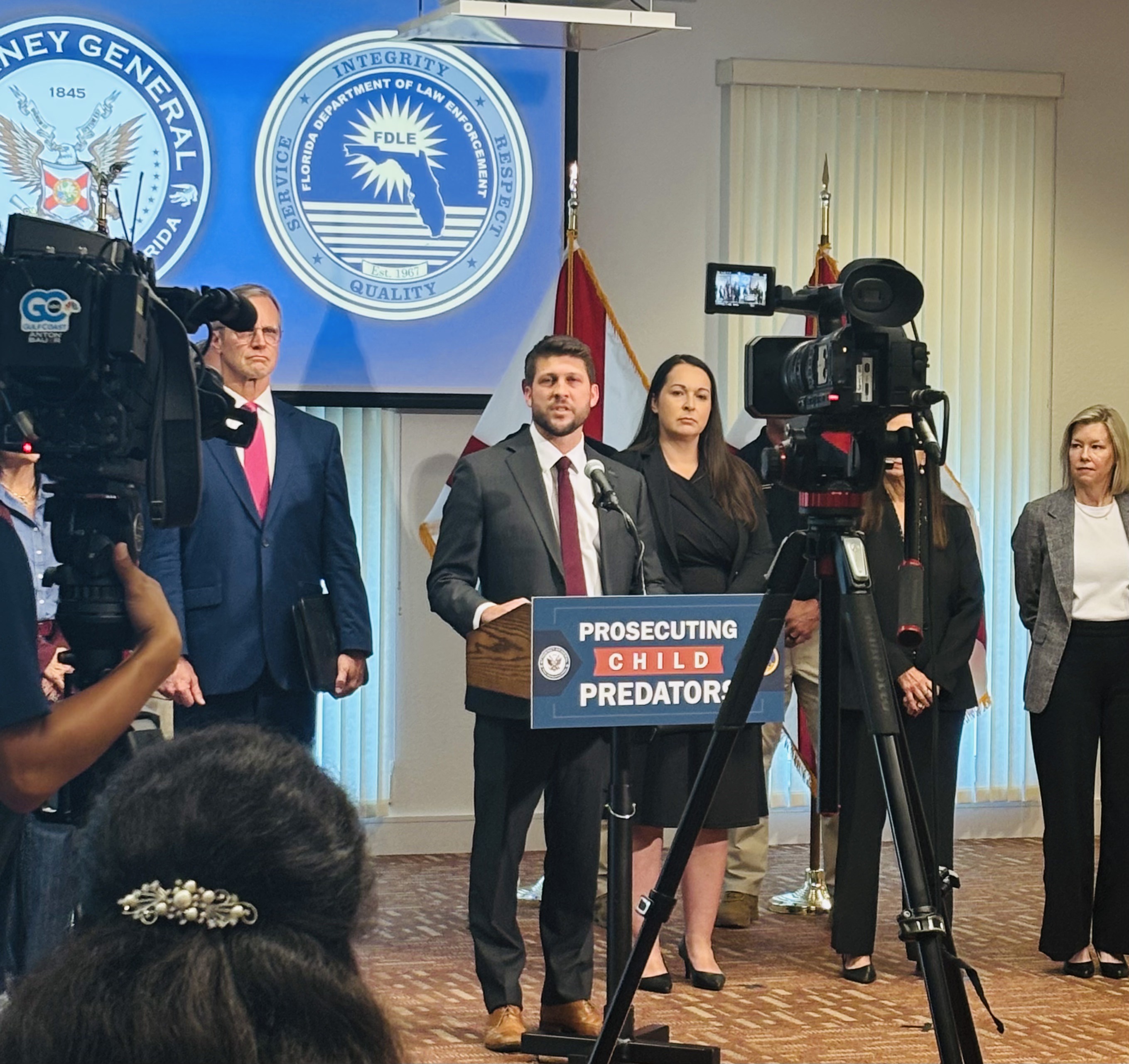 Florida Attorney General James Uthmeier addresses a gathering of press and law enforcement on FSW's Collier Campus.