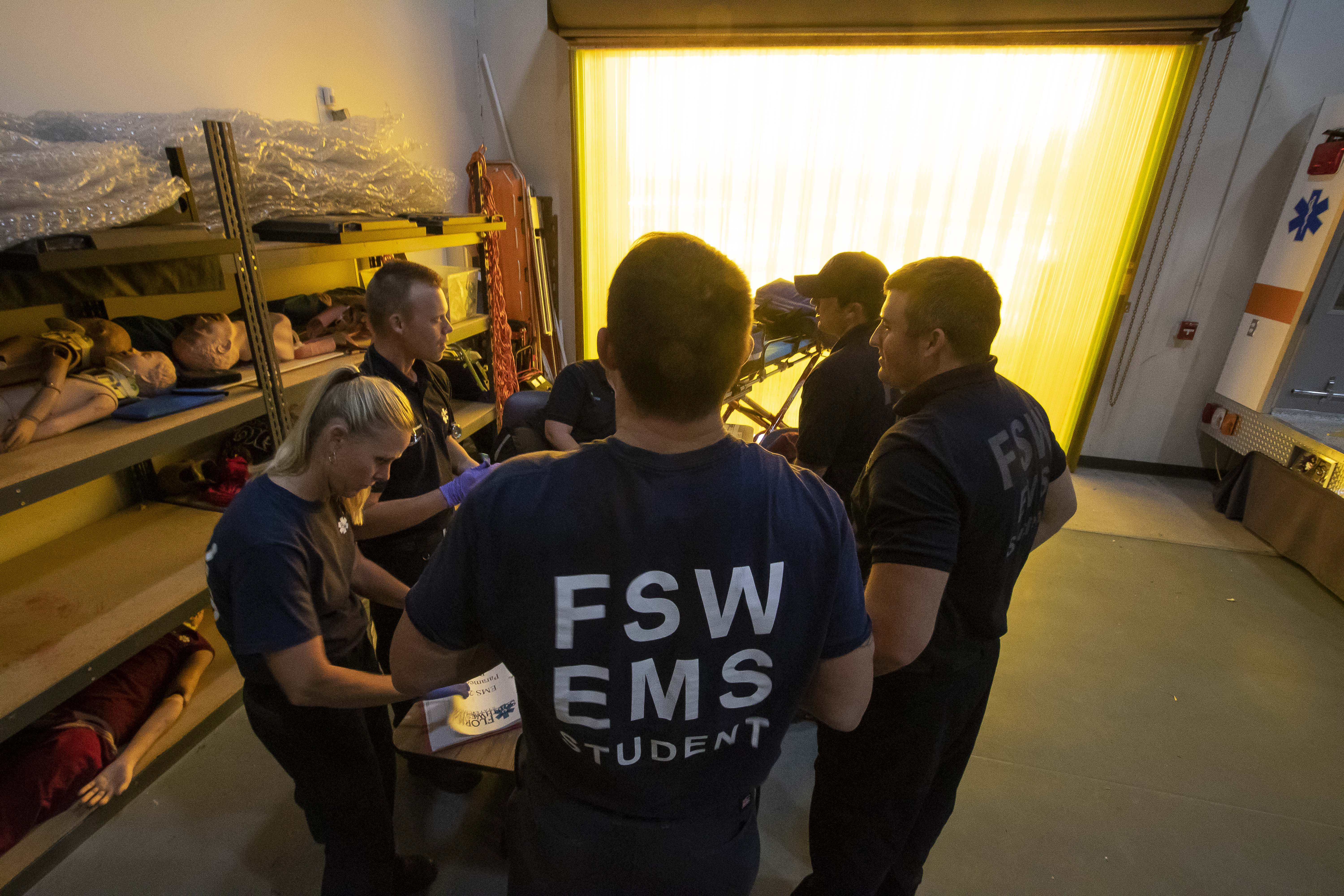 FSW EMS student practicing emergency medical techniques on a training mannequin in a practice settting.