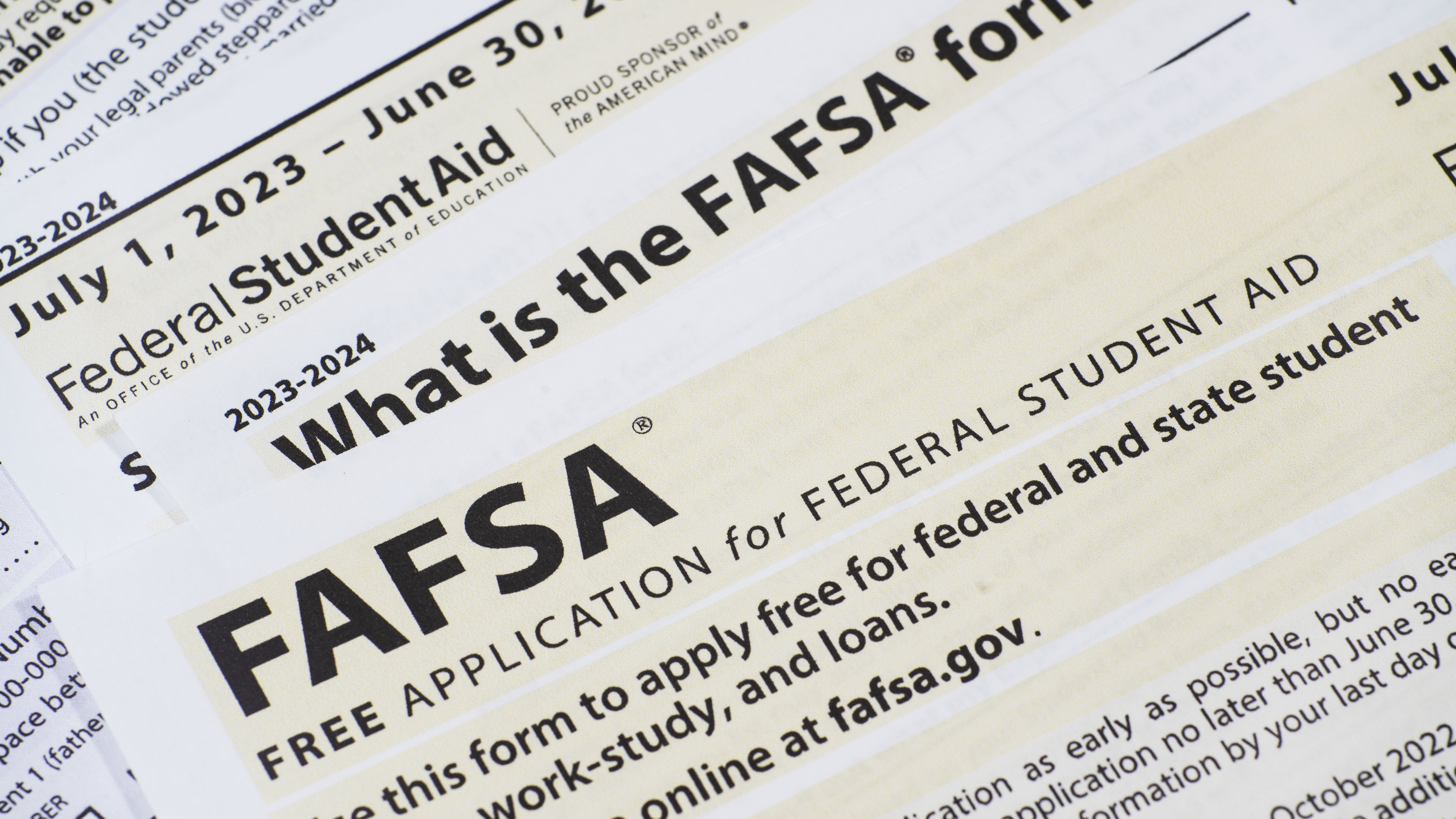 Paper documents representing the FAFSA form.