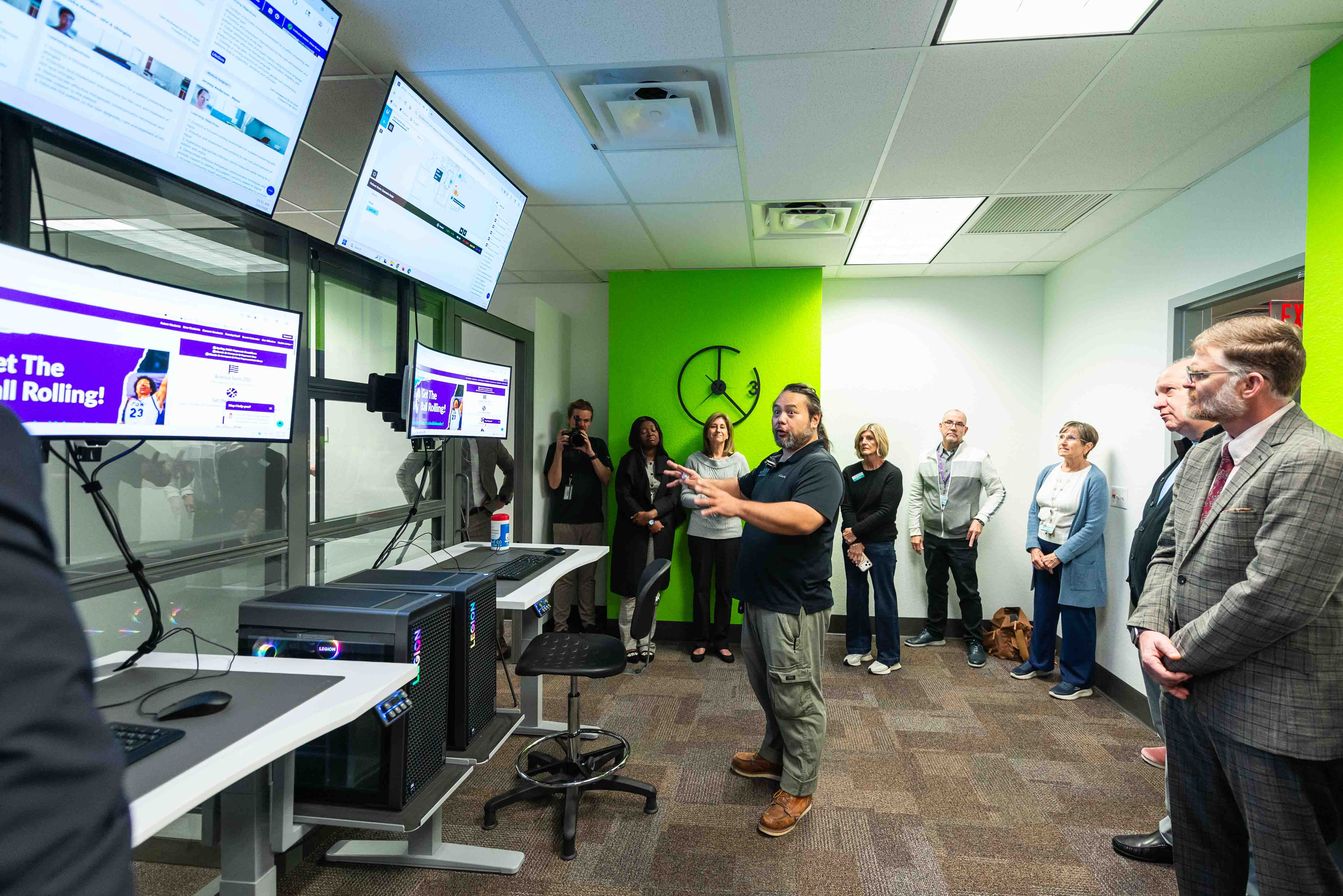 Mon Navarro, IIET program support specialist, gives an overview of the XR Suite technology to guests at the IIET grand opening.