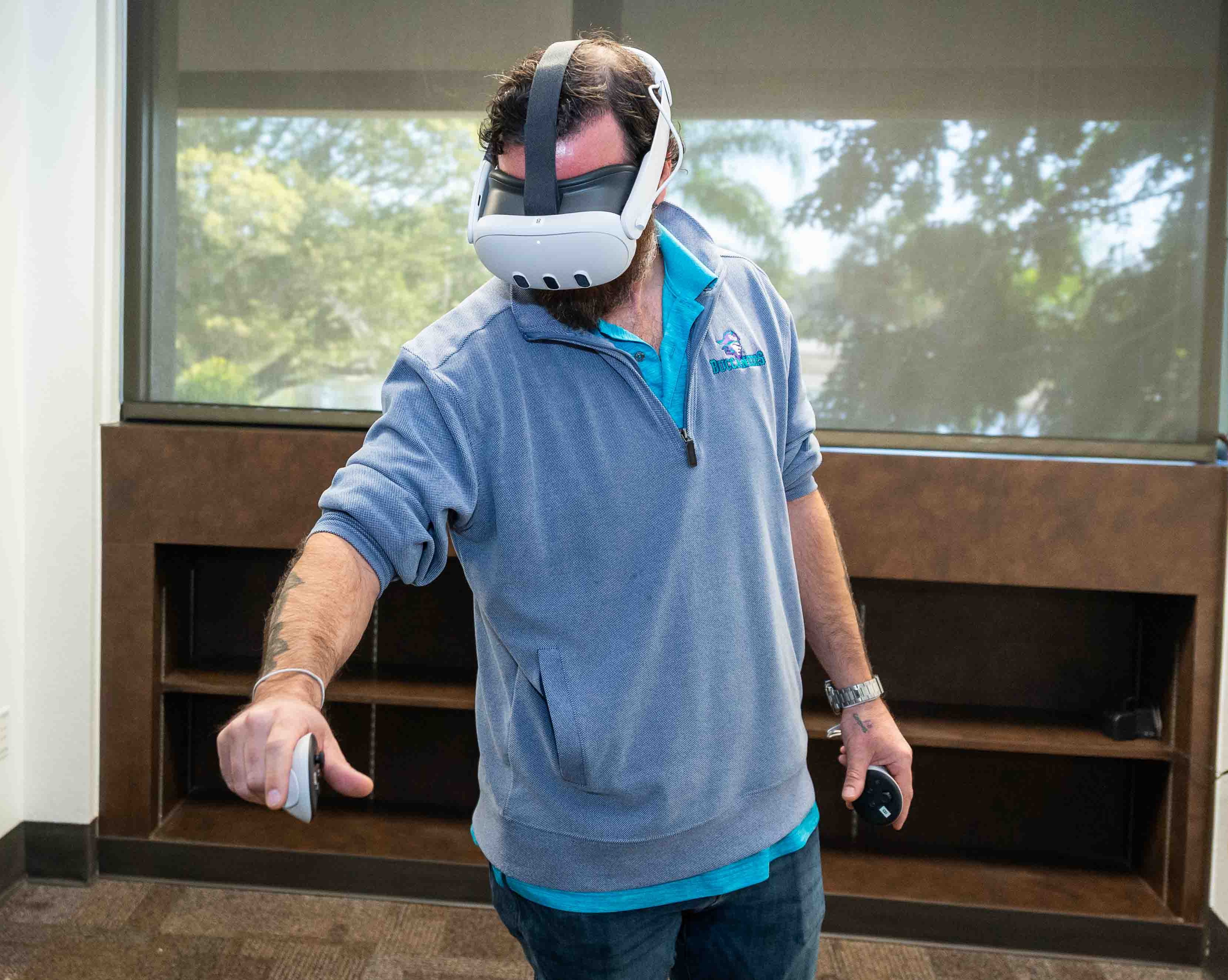 Michael Myers, manager of FSW’s Daveler Innovation Center, participates in a hands-on virtual reality simulation during the IIET grand opening.