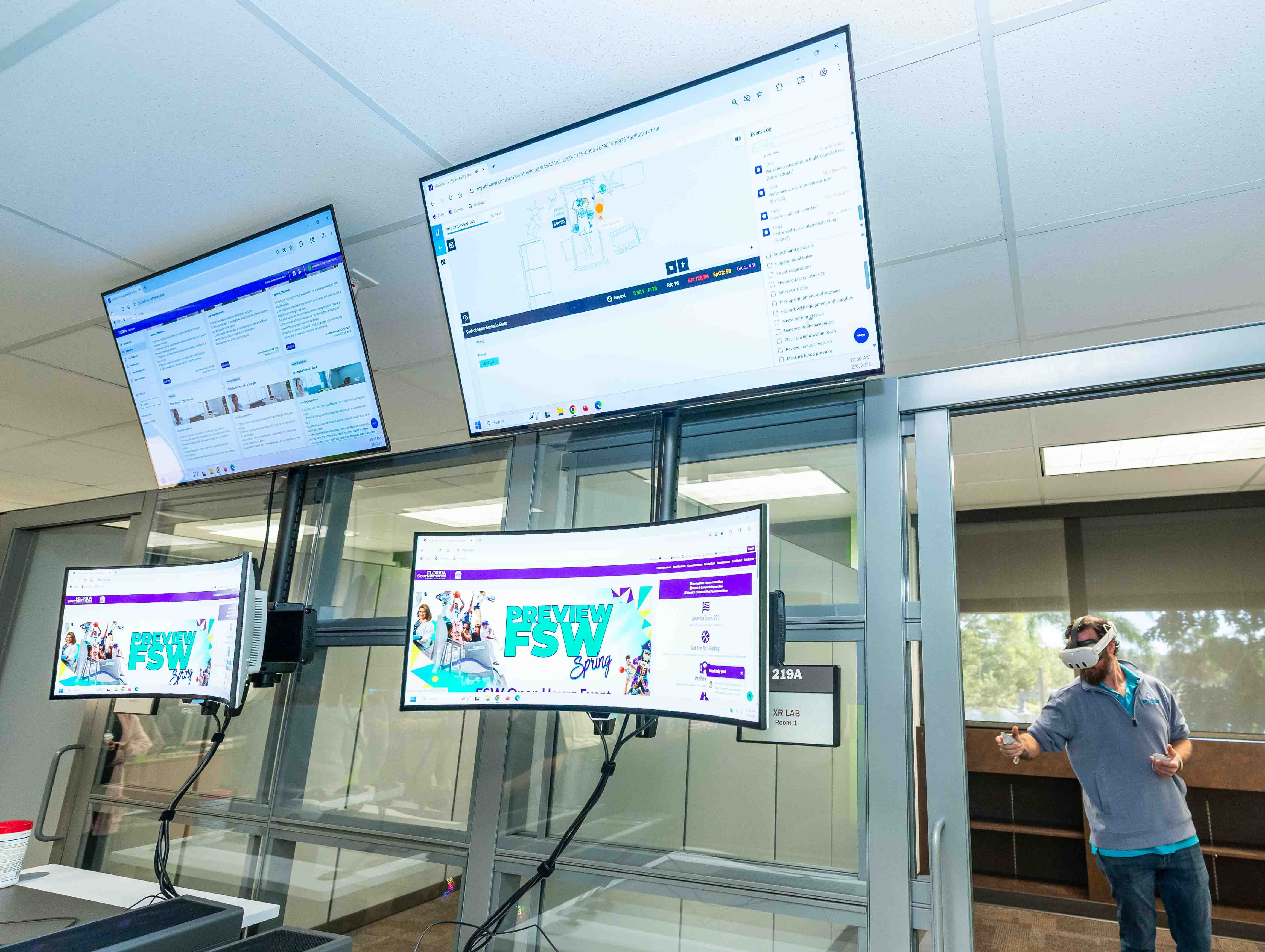 Overhead monitors provide a live view of the XR simulation, allowing instructors to monitor student progress and performance in real time.