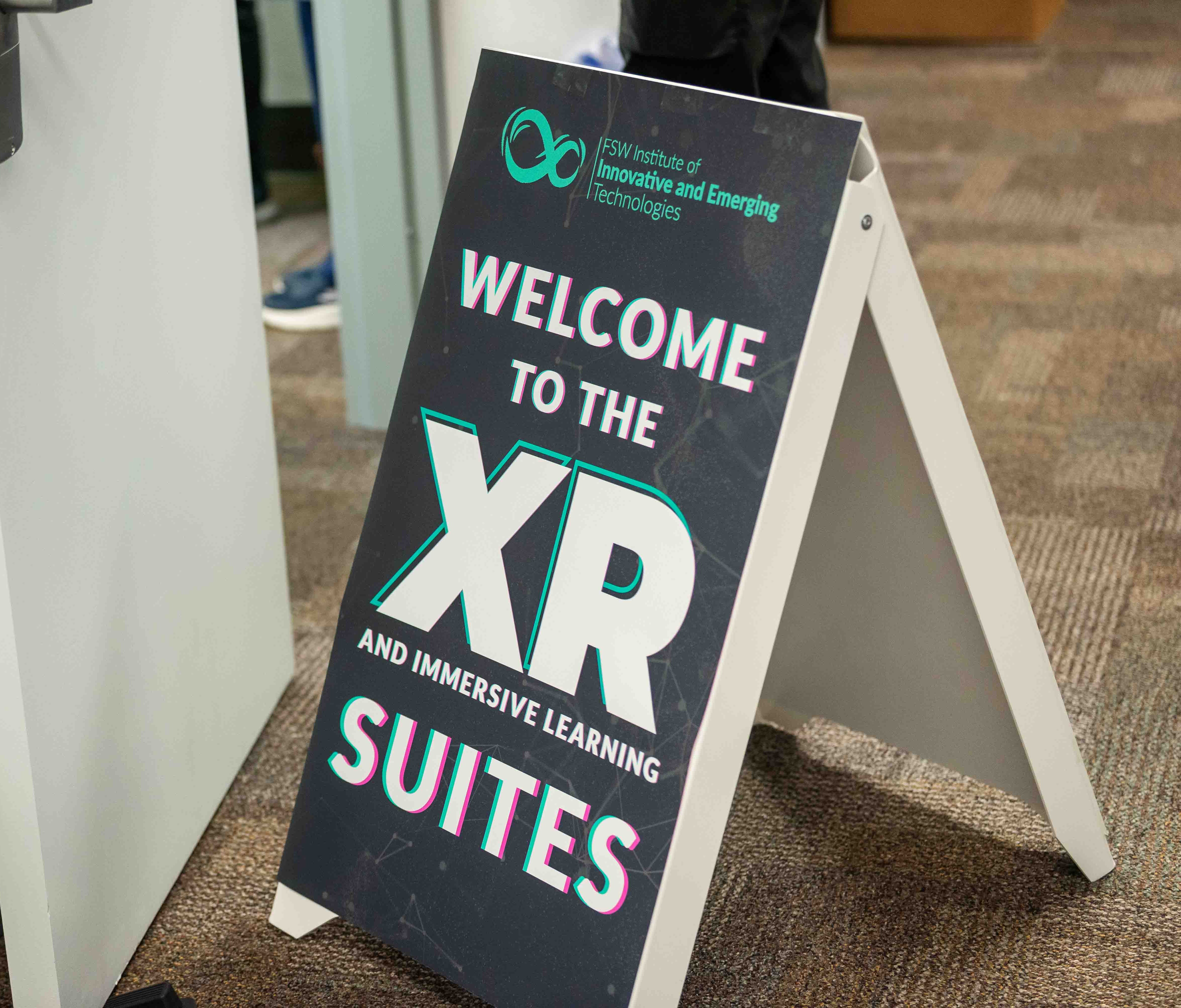Signage welcomes guests to FSW’s XR Suites during the grand opening of the IIET.