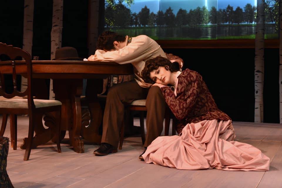 �鶹Ů�� Theatre production mid-scene showcases a student performing